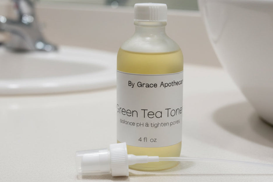 Bottle of toner by Grace Apothecary on a metallic surface